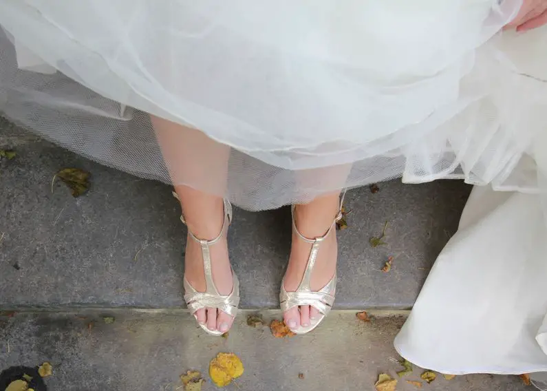 wedding dress with gold shoes